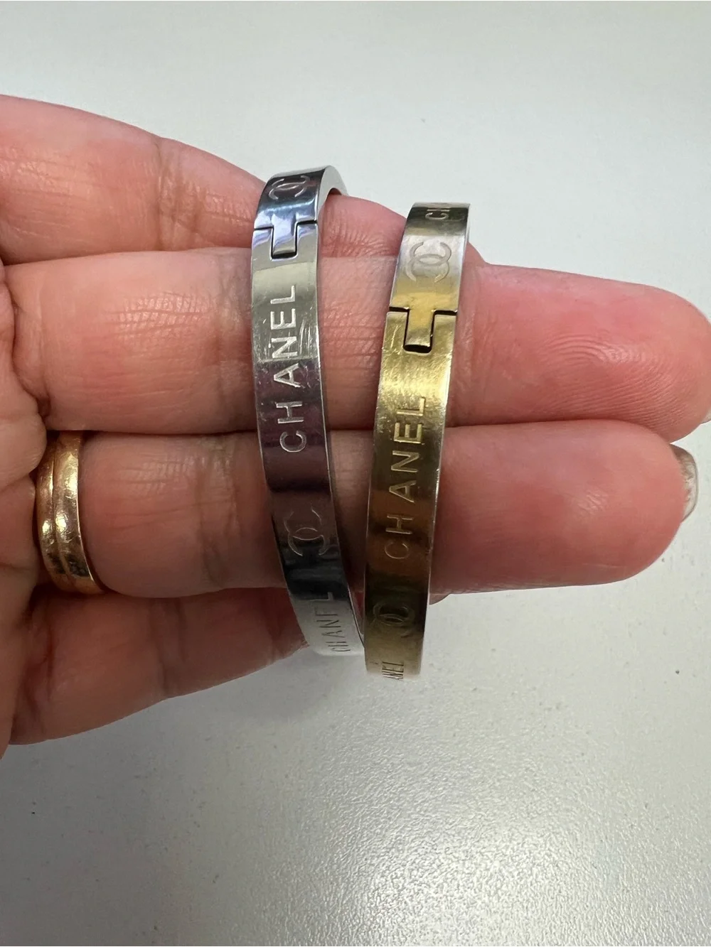 Chanel, LV, Gucci Stackable Silver and Gold Logo Bangle Set - Picture 5 of 16